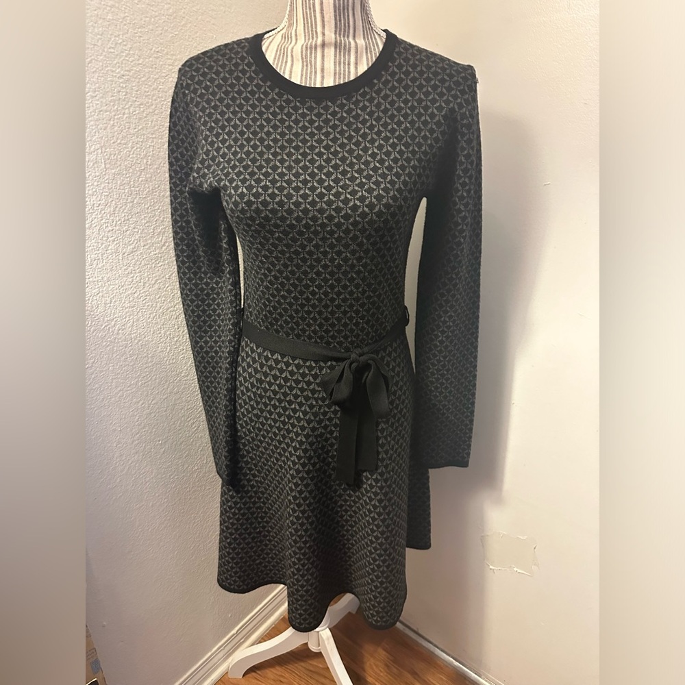 Mac studio plaque and gray dress